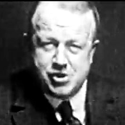 Frank Gilbreth, head and
shoulders, mid-sentence — a frame from his own film.
